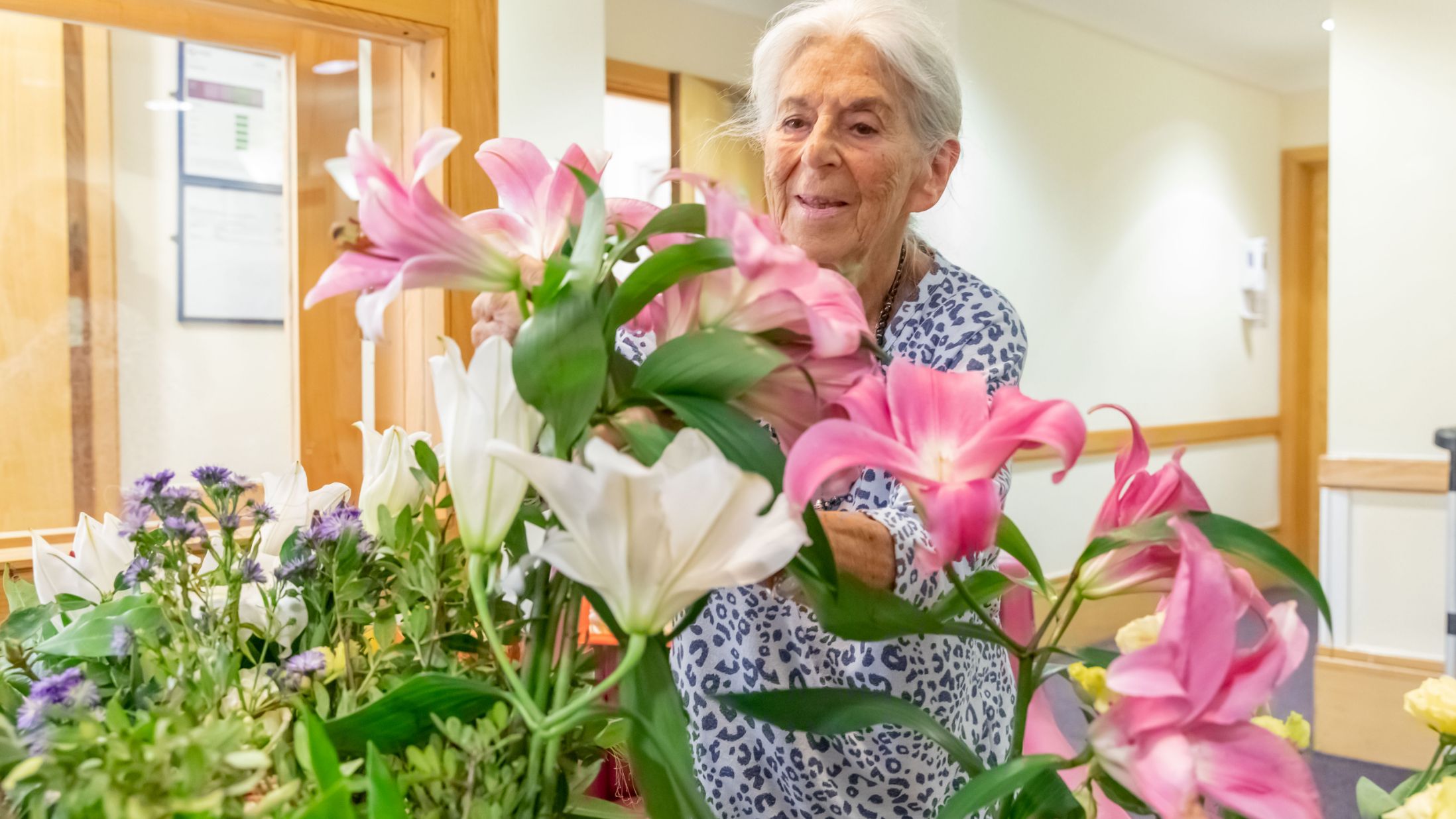Rosetrees care home resident with flowers