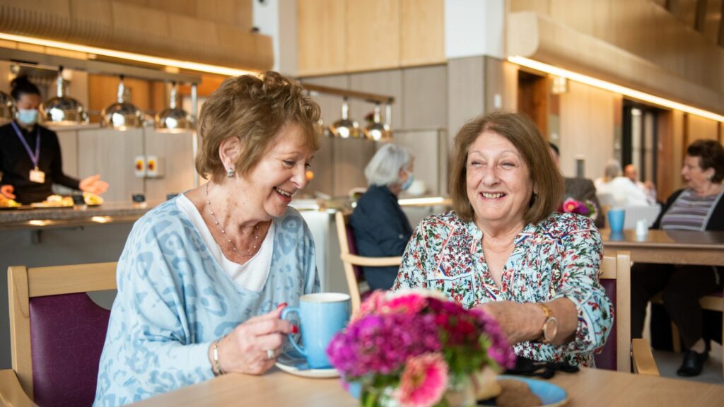 two ladies having a cup of tea at the Ronson Family Community Centre