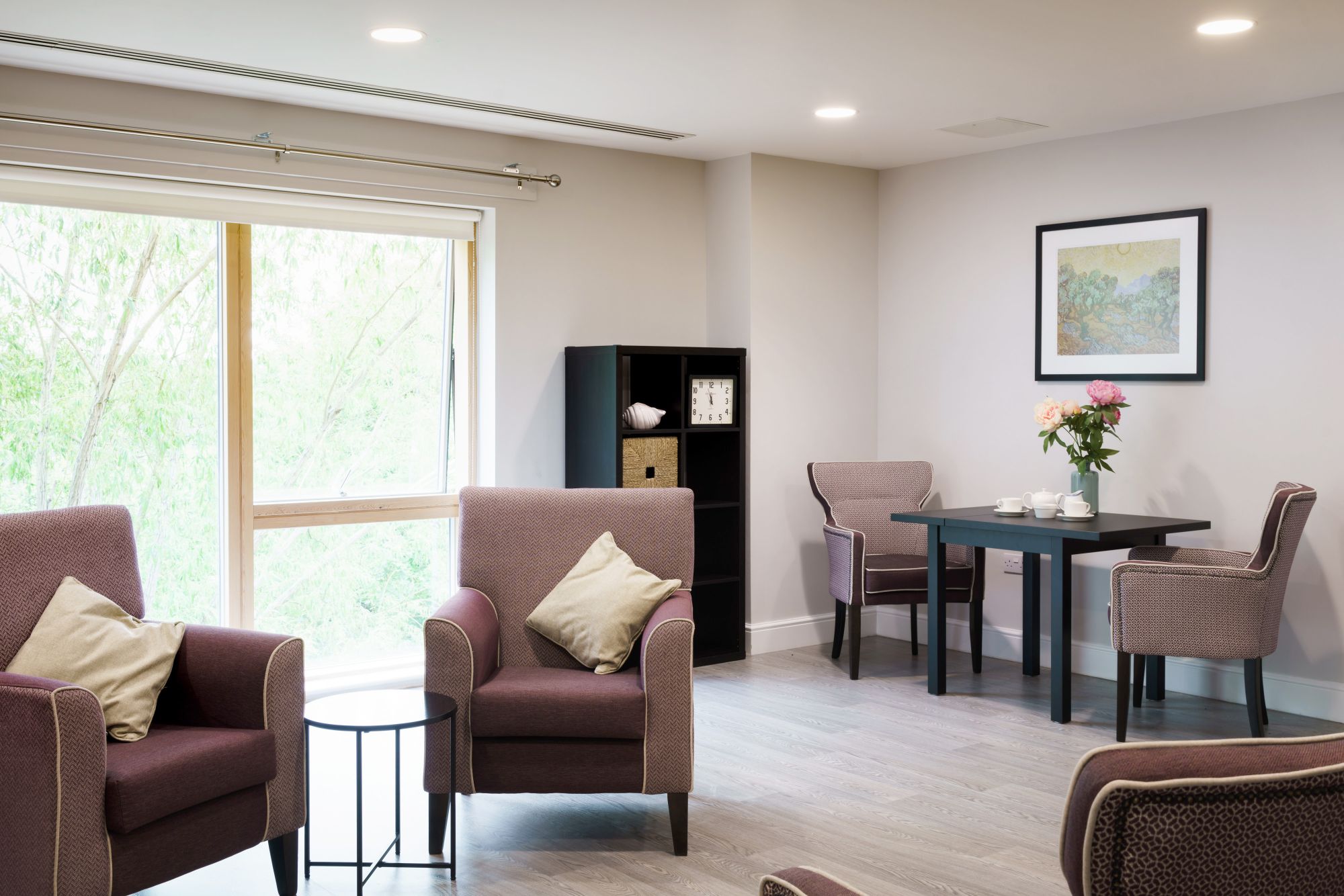 Kun Mor and George Kiss Home Lounge A calm, purple lounge space with arm chairs and a table with a tea service set up